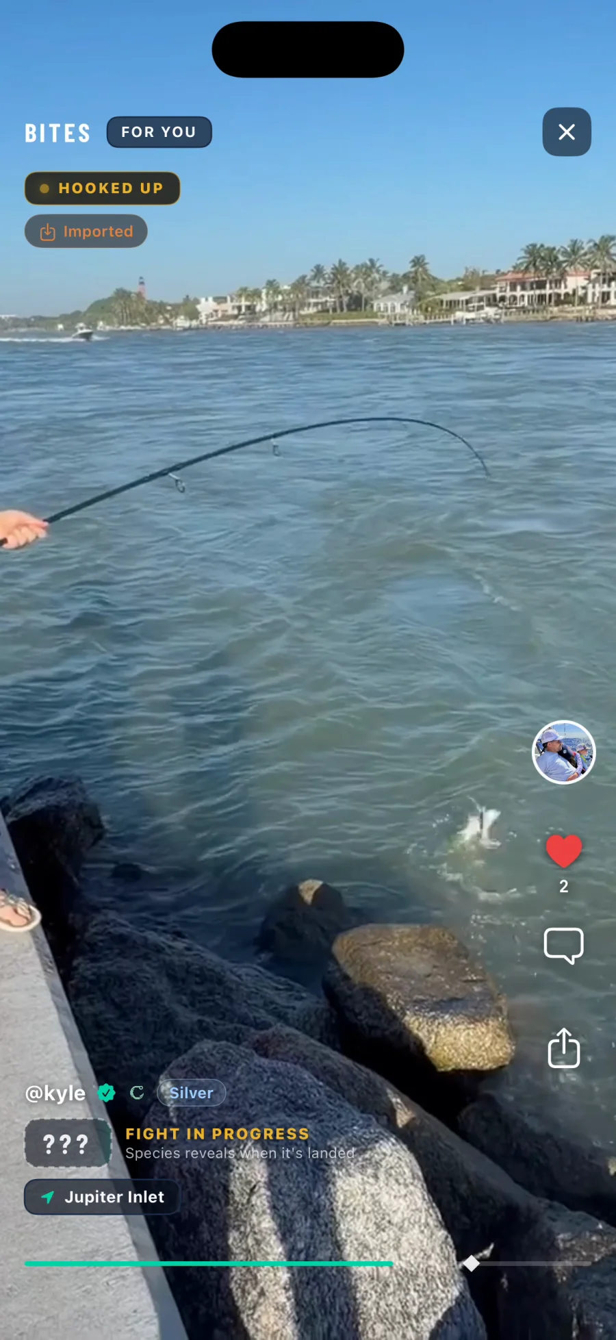A Bite mid fight, the badge reading Hooked Up and the species hidden behind a card of question marks that says it reveals when the fish is landed